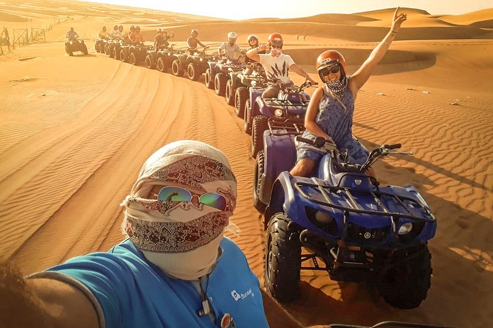 Experience the thrill of quad biking across stunning red dunes followed by an unforgettable evening of BBQ and traditional entertainment under the starry desert sky.